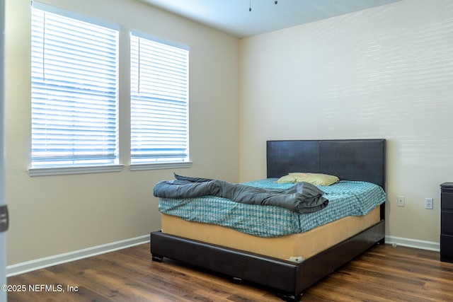 bedroom featuring dark hardwood / wood-style floors