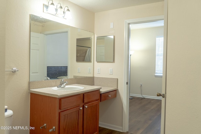 bathroom with wood-type flooring and vanity