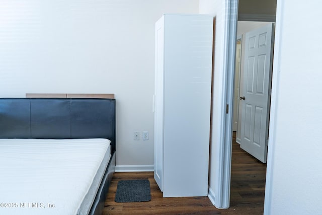 bedroom featuring dark hardwood / wood-style floors