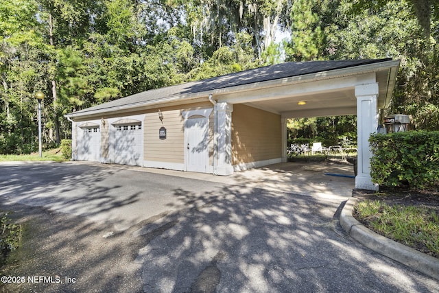 garage featuring a carport