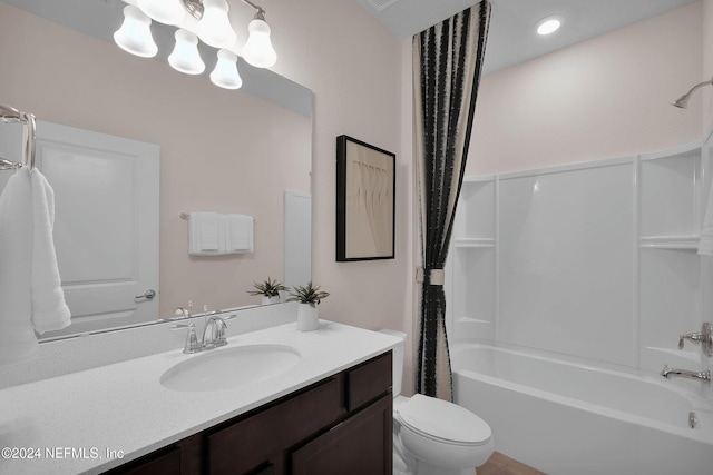 full bathroom with shower / tub combo, vanity, and toilet