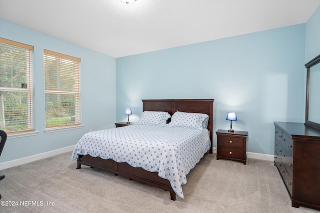 bedroom with light carpet