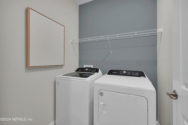 laundry room with washing machine and dryer