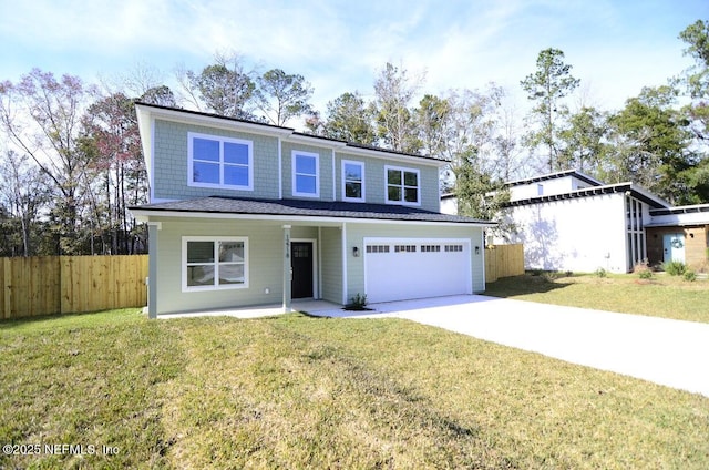 view of front property with a front lawn and a garage