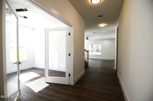 hallway featuring dark wood-type flooring