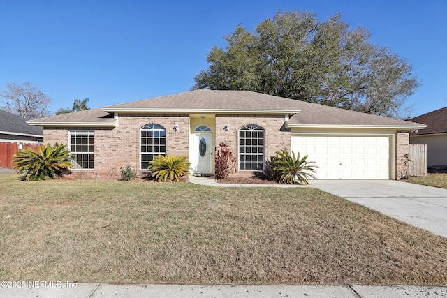 single story home with a garage and a front lawn