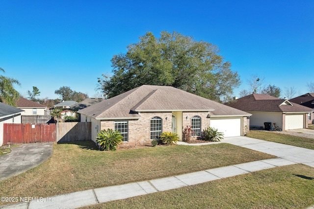 ranch-style home with a garage and a front lawn