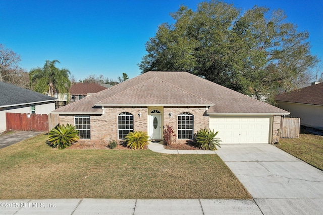 ranch-style house with a garage and a front yard