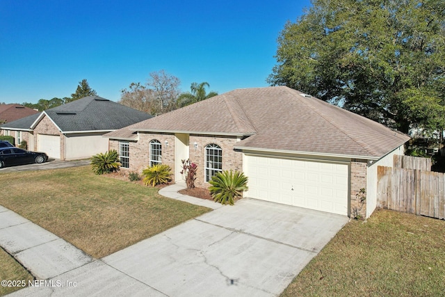 single story home featuring a front yard and a garage