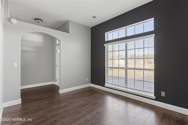 unfurnished room featuring dark hardwood / wood-style floors