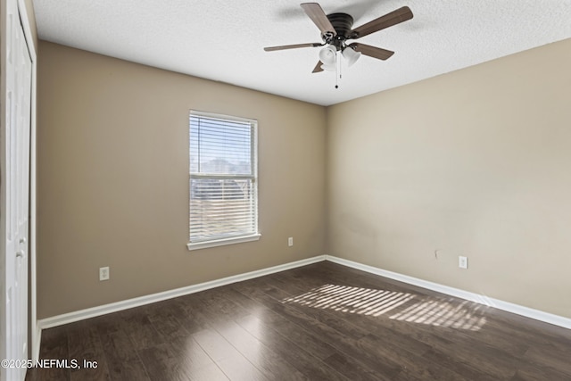 unfurnished room featuring a textured ceiling, ceiling fan, and dark hardwood / wood-style floors