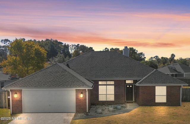 view of front of property with a garage