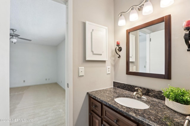 bathroom featuring vanity and ceiling fan