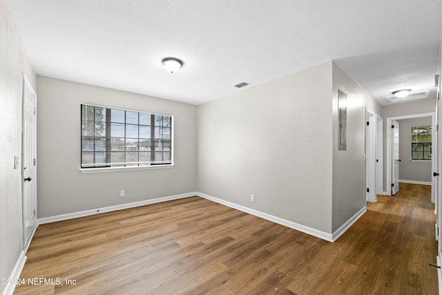 empty room featuring wood-type flooring