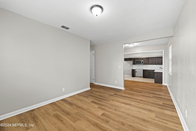 unfurnished living room with light wood-type flooring