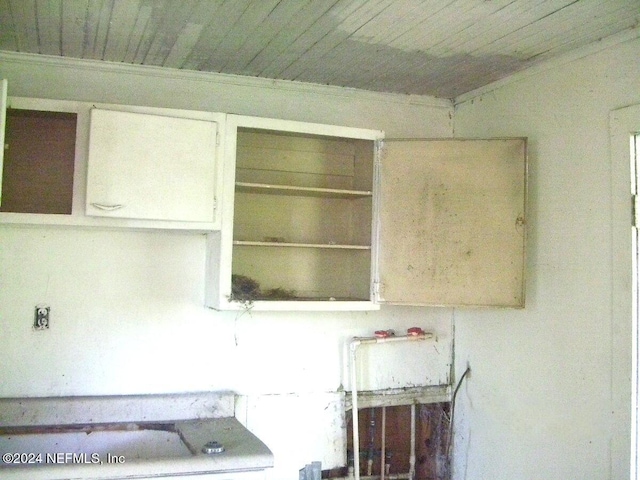 interior details with wooden ceiling and crown molding