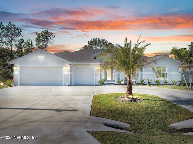 view of front facade featuring a yard and a garage