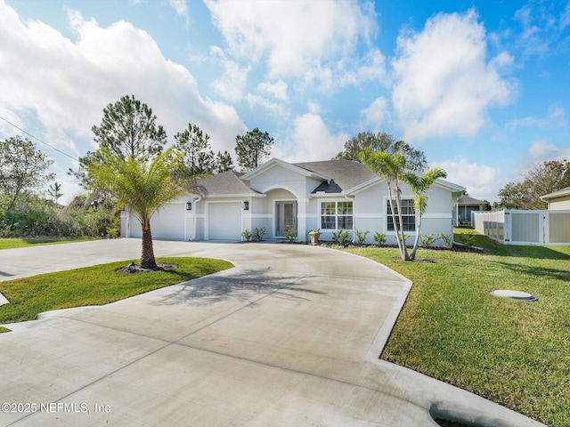 ranch-style home featuring a front yard and a garage