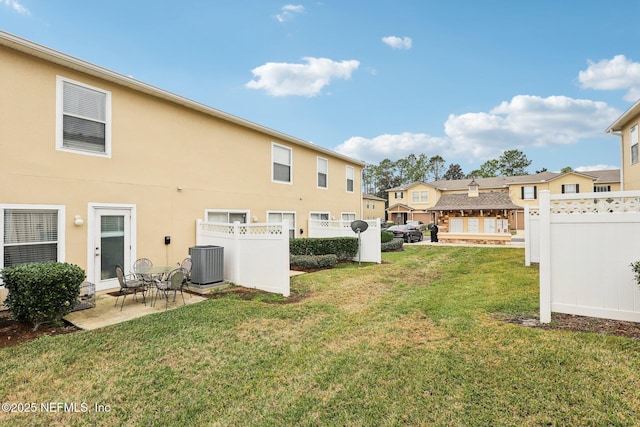 view of yard featuring cooling unit and a patio area