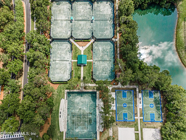 birds eye view of property with a water view