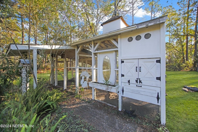 view of community with a storage shed and a lawn