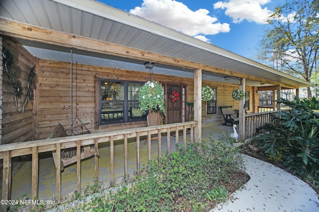 entrance to property with covered porch