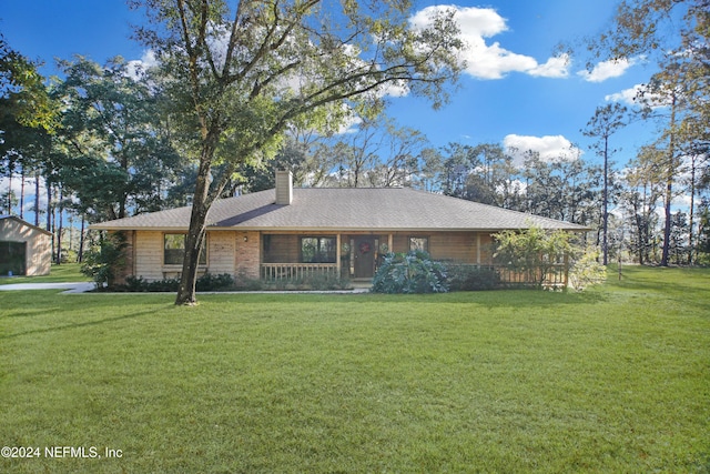 ranch-style home with a porch and a front lawn