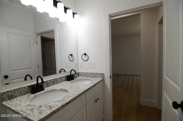 bathroom featuring hardwood / wood-style floors and vanity