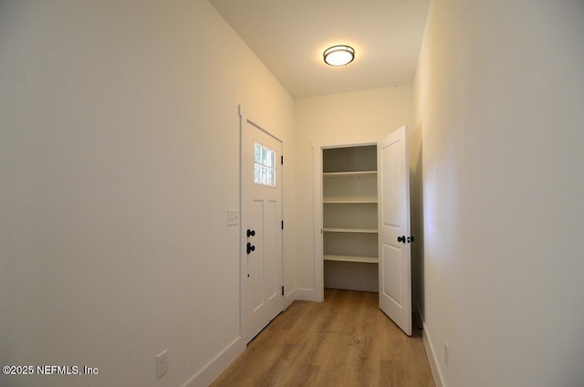 doorway to outside with light hardwood / wood-style floors