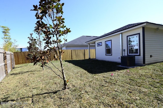 view of yard featuring central air condition unit