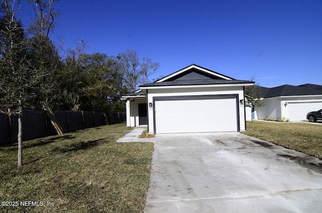 ranch-style house featuring a garage and a front lawn