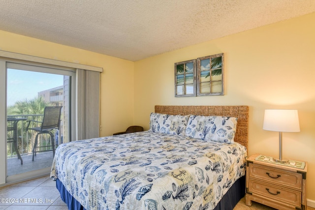 tiled bedroom with access to exterior and a textured ceiling