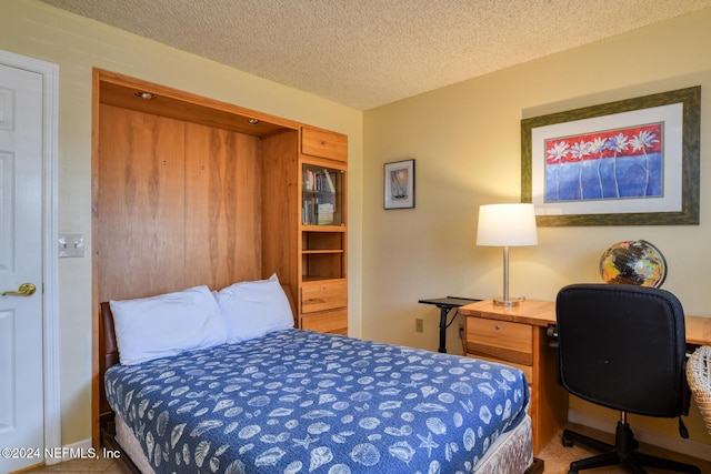 bedroom featuring a textured ceiling