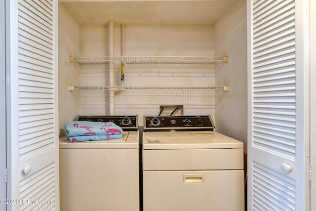 laundry area featuring washing machine and clothes dryer