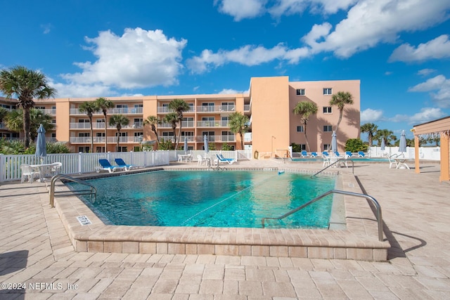 view of swimming pool featuring a patio