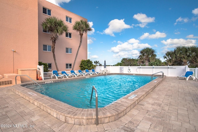 view of pool featuring a patio