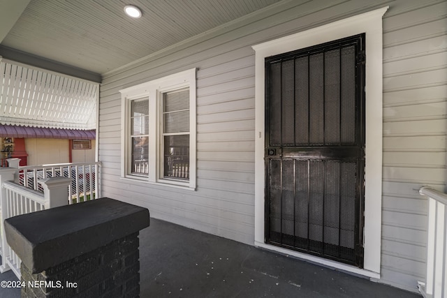 entrance to property with a porch