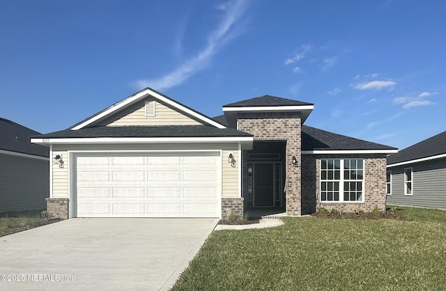 view of front of house featuring a garage, a front yard, concrete driveway, and brick siding