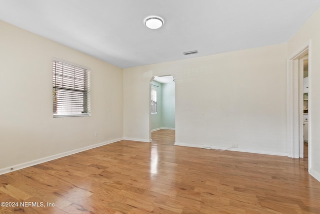 spare room with a healthy amount of sunlight and light wood-type flooring