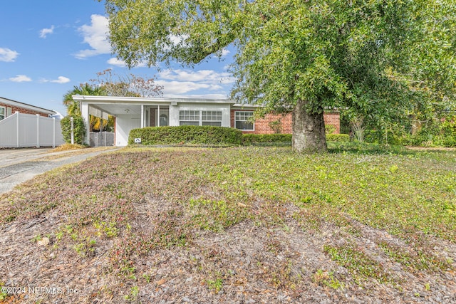 ranch-style home with a carport