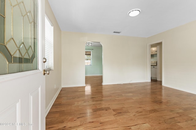 spare room with hardwood / wood-style flooring