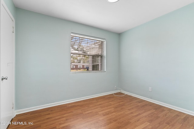 spare room featuring hardwood / wood-style flooring