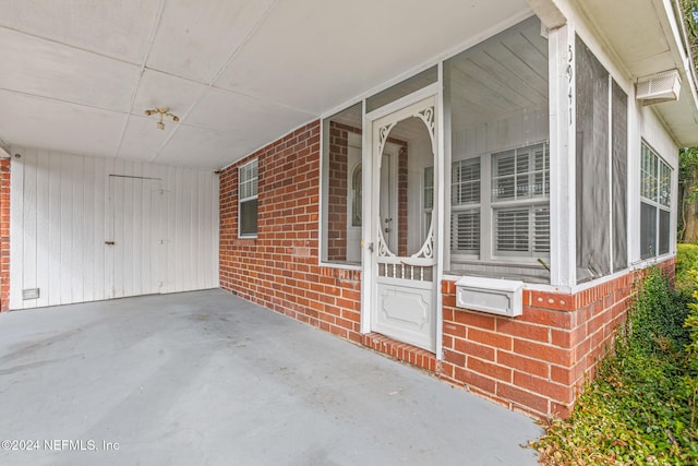 entrance to property featuring a carport