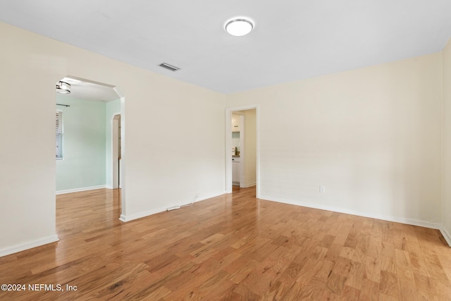 empty room with light hardwood / wood-style floors