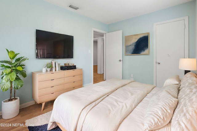 bedroom with light hardwood / wood-style floors