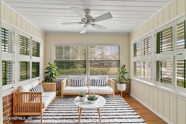 sunroom featuring ceiling fan