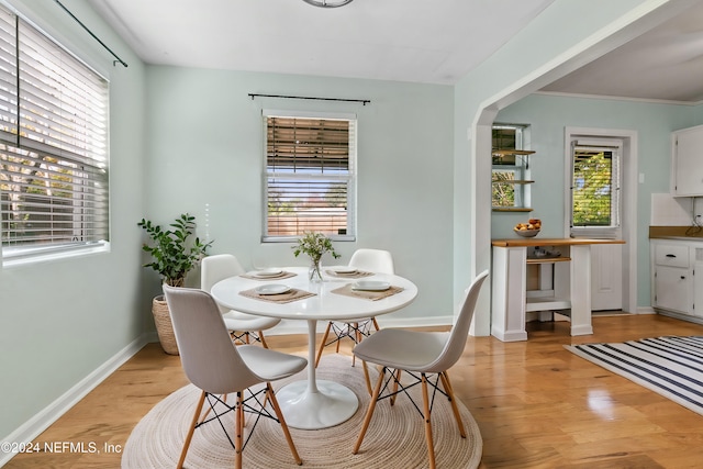 dining space with light wood-type flooring