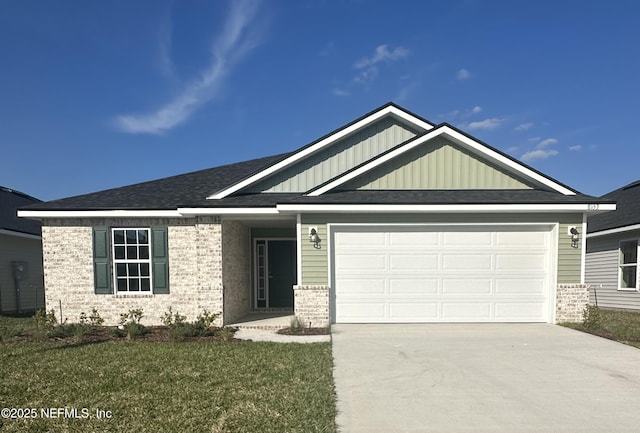 ranch-style house featuring driveway, an attached garage, a front lawn, board and batten siding, and brick siding