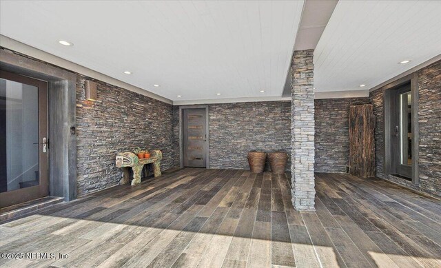 unfurnished living room with dark hardwood / wood-style floors