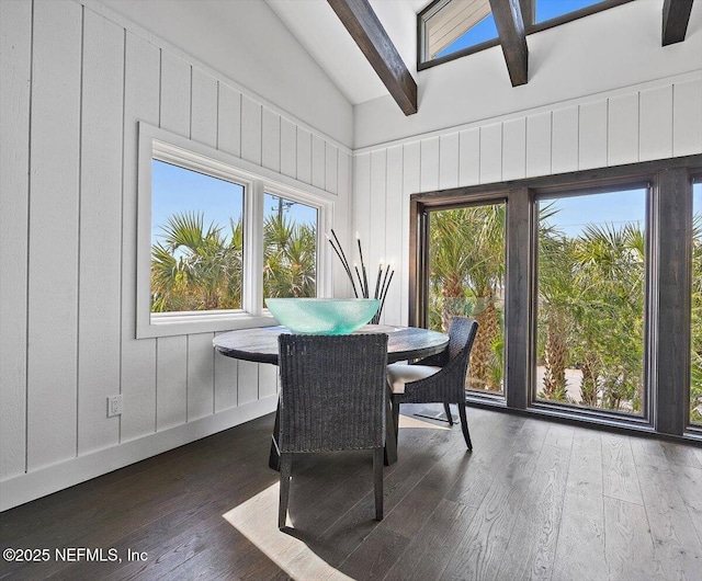 sunroom featuring lofted ceiling with beams